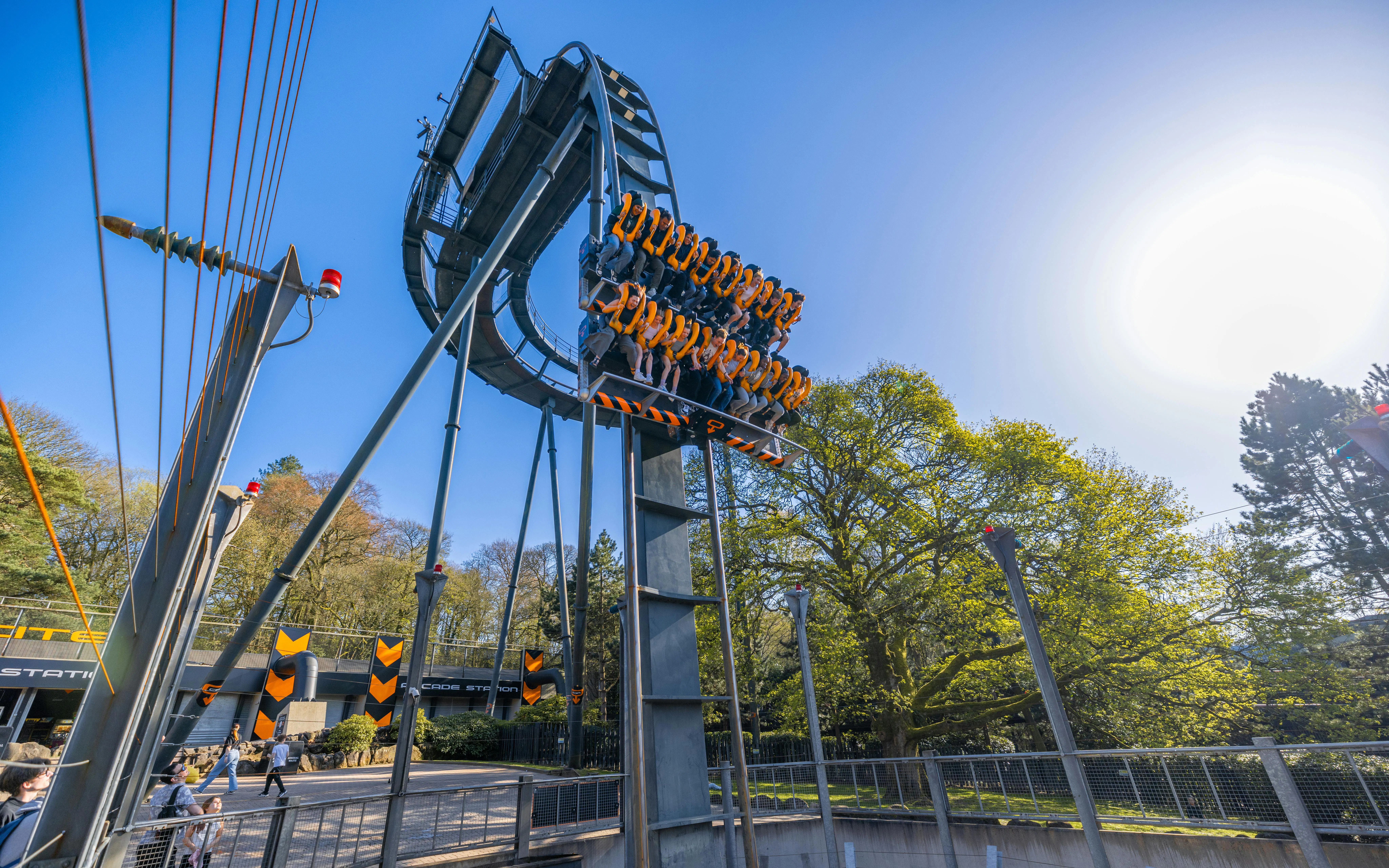Roller coaster ride at Alton Towers with passengers suspended vertically.