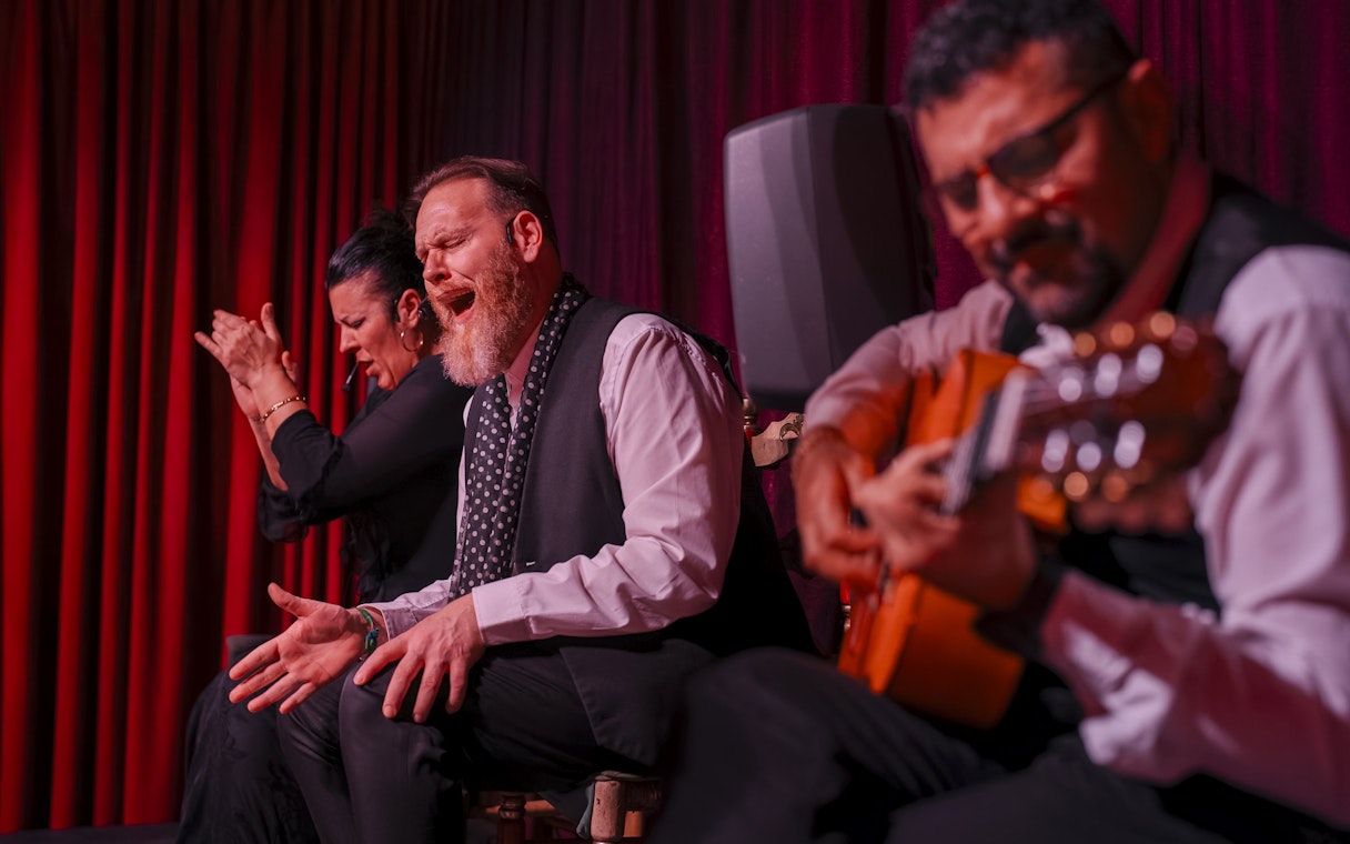 Flamenco performers at Palau Dalmases, Barcelona, with guitarist and singer.