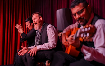 Flamenco performers at Palau Dalmases, Barcelona, with guitarist and singer.
