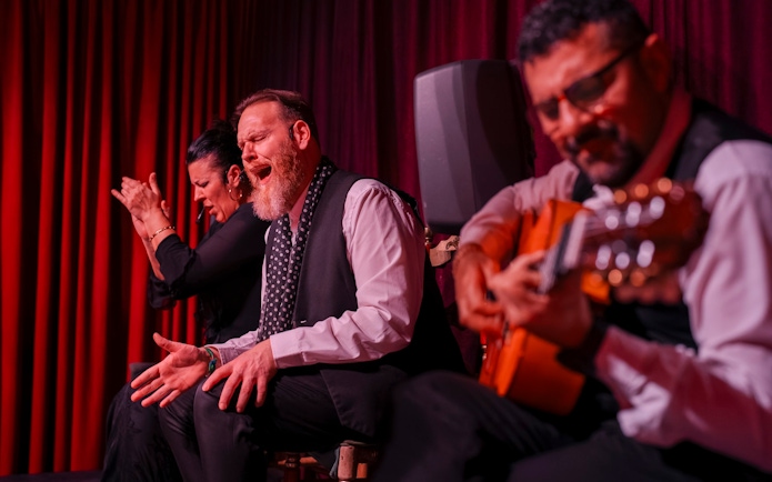 Flamenco performers at Palau Dalmases, Barcelona, with guitarist and singer.