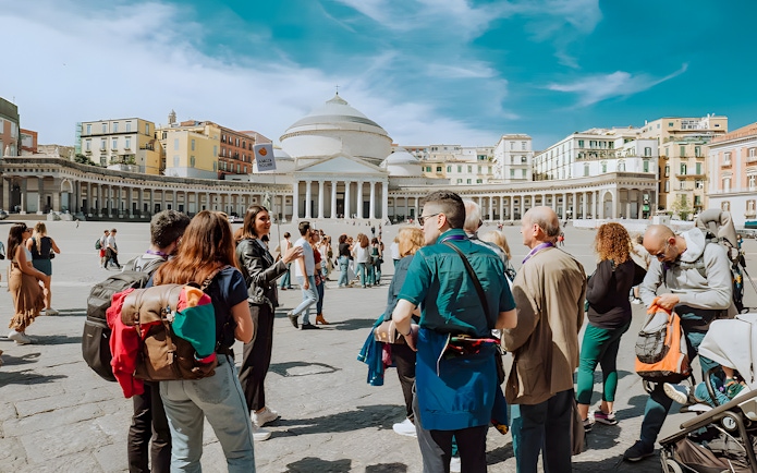 Group tour in Naples at Piazza del Plebiscito, near Castel Sant'Elmo and Certosa di San Martino.