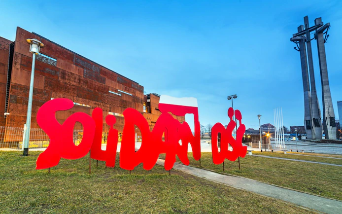 European Solidarity Centre exterior with red "Solidarność" sign in Gdańsk, Poland.