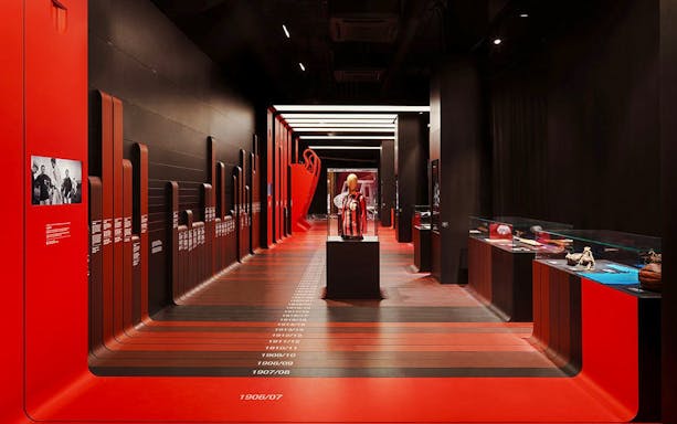 Casa Milan museum gallery with historical artefacts and timeline display.