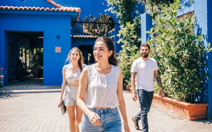 Tourists walking in the courtyard of Frida Kahlo Museum, Mexico City.