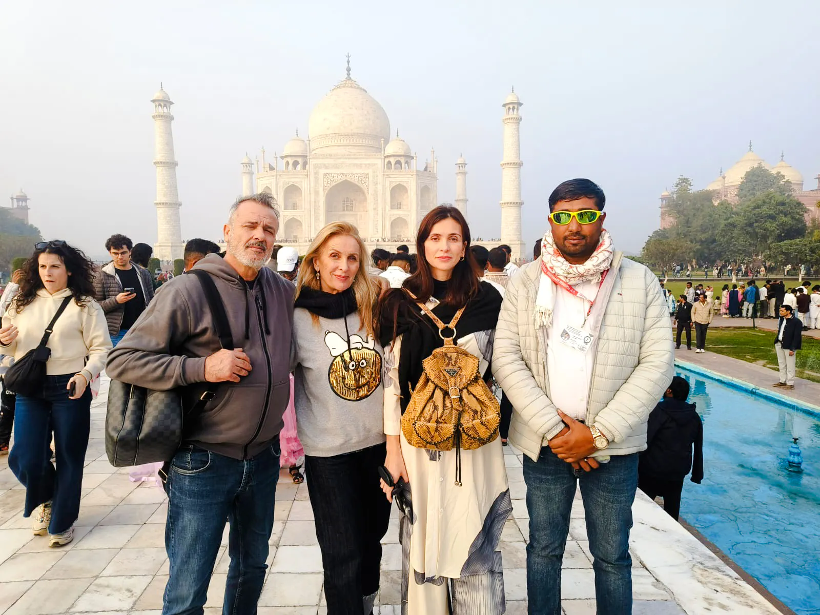 Tourists at the Taj Mahal during Agra day tour from Delhi by train.