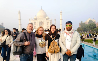 Tourists at the Taj Mahal during Agra day tour from Delhi by train.
