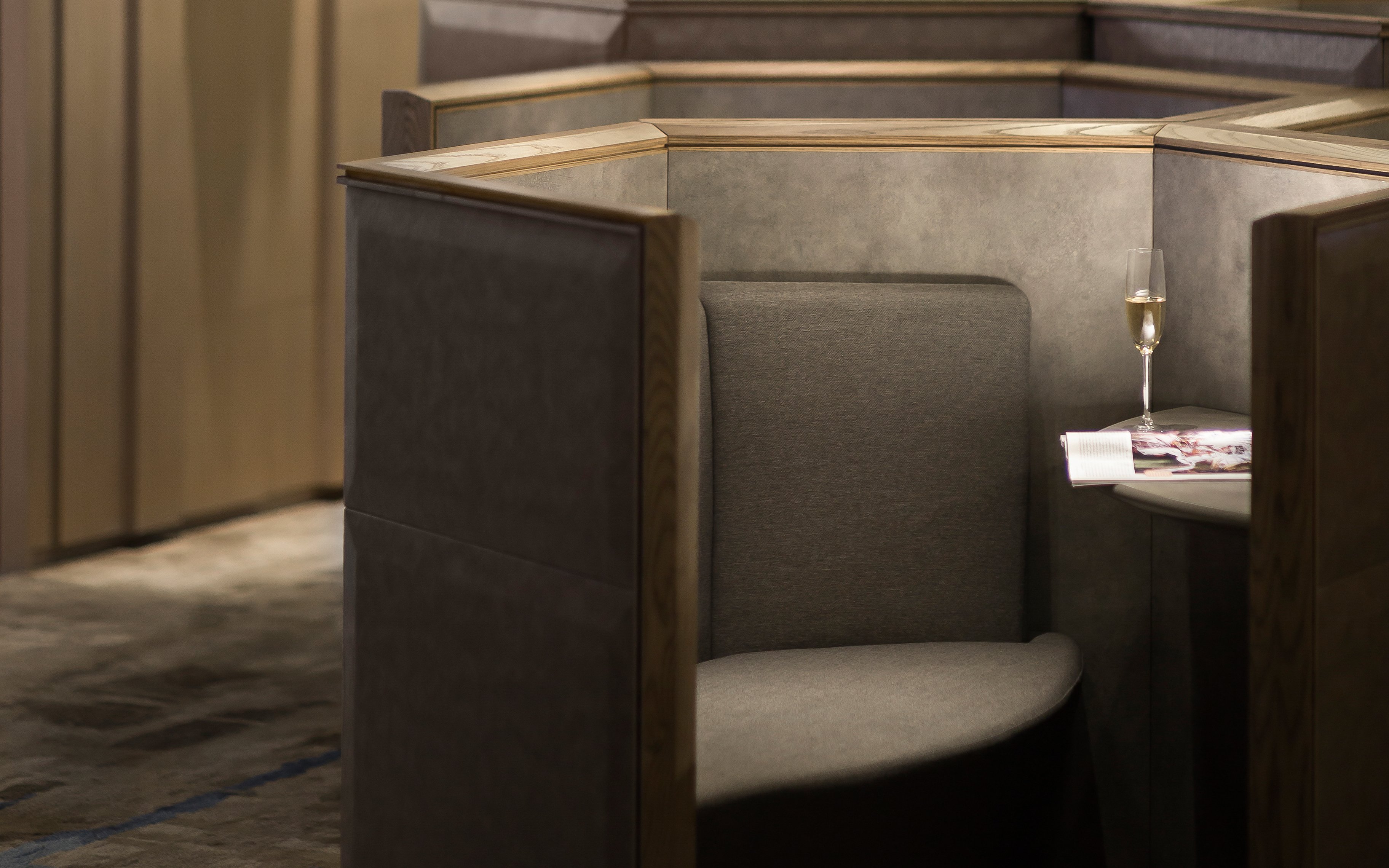 Private seating area with a table and champagne at Plaza Premium Lounge, Zone D, Taipei, Taiwan.