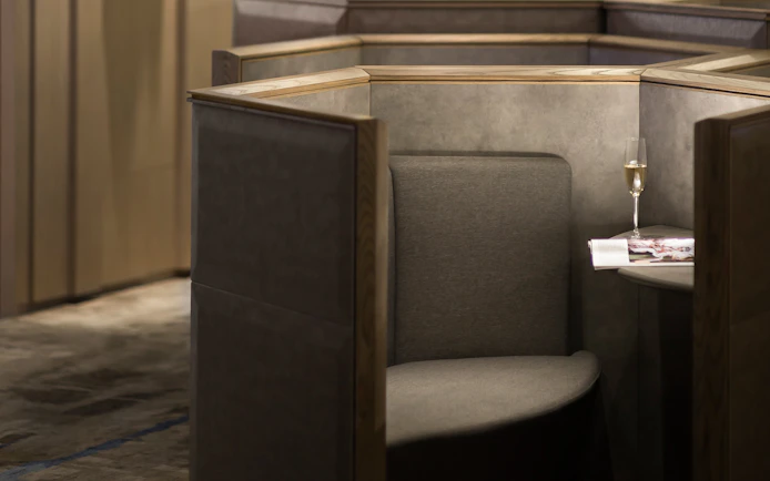 Private seating area with a table and champagne at Plaza Premium Lounge, Zone D, Taipei, Taiwan.