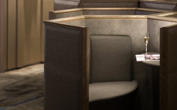 Private seating area with a table and champagne at Plaza Premium Lounge, Zone D, Taipei, Taiwan.