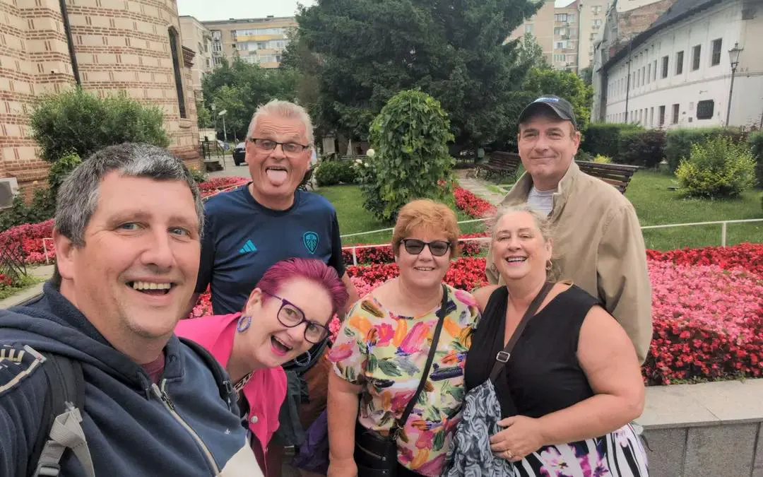 Group enjoying Văcărești Nature Park with colorful flowers, Bucharest.