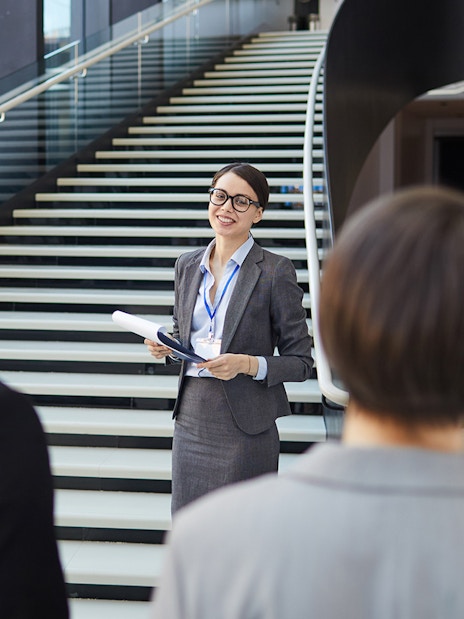 Tour guide leading a group at the Shard, London.
