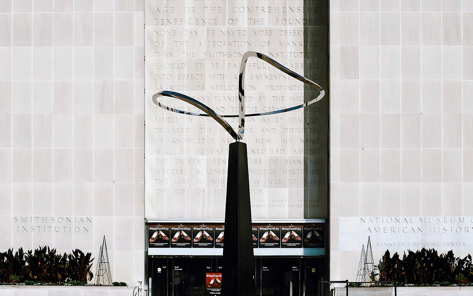 Smithsonian National Museum of American History entrance with modern sculpture.