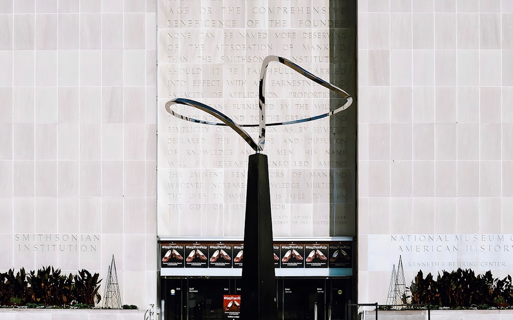 Smithsonian National Museum of American History entrance with modern sculpture.