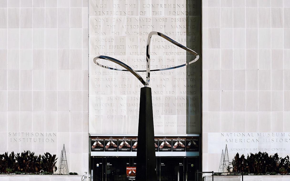 Smithsonian National Museum of American History entrance with modern sculpture.