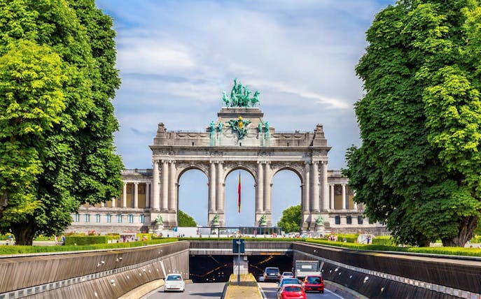 Triumphal Arch at Cinquantenaire Park, Brussels, on a sunny day.