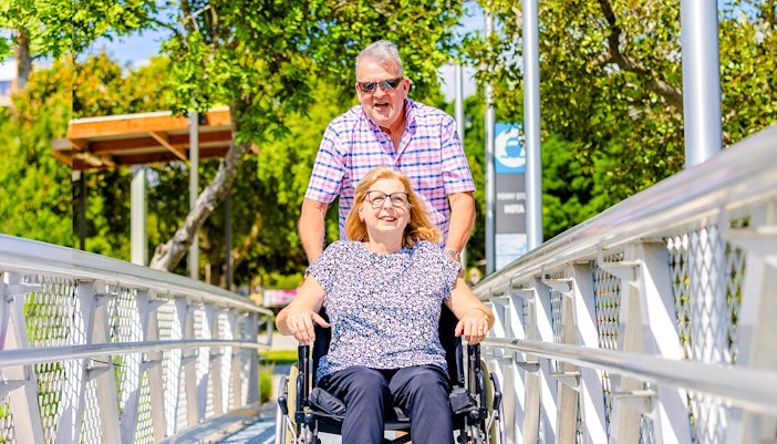 Differently abled woman in wheelchair boarding cruise on Gold Coast HOHO Sightseeing Cruise.