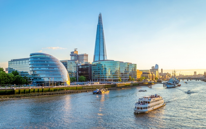Thames River cruise passing the Shard and City Hall in London.