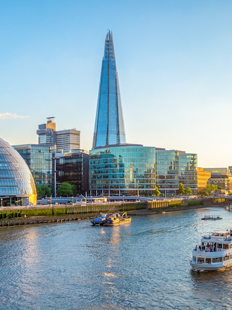 Thames River cruise passing the Shard and City Hall in London.