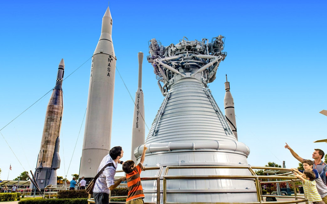 Visitors exploring rockets at the Kennedy Space Center's Rocket Garden.