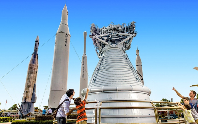 Visitors exploring rockets at the Kennedy Space Center's Rocket Garden.