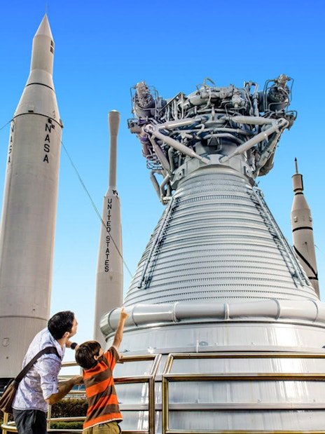 Visitors exploring rockets at the Kennedy Space Center's Rocket Garden.