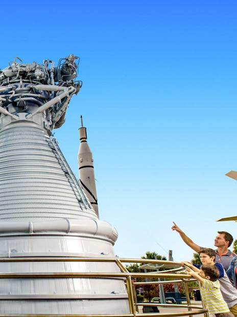 Visitors exploring rockets at the Kennedy Space Center's Rocket Garden.