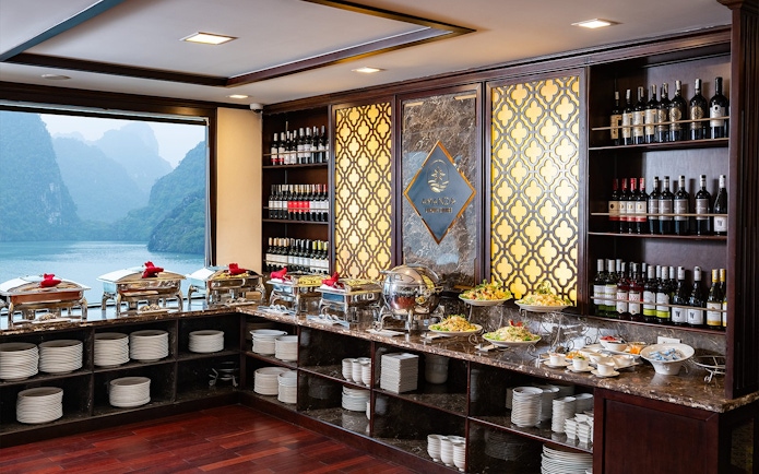 Buffet setup at Amanda Luxury Cruise restaurant with scenic ocean view.