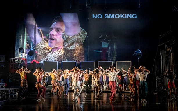 Dancers performing on stage during "A Chorus Line" musical.