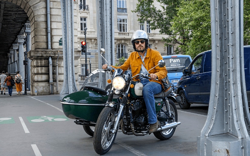 Sidecar motorcycle tour under Paris bridge.