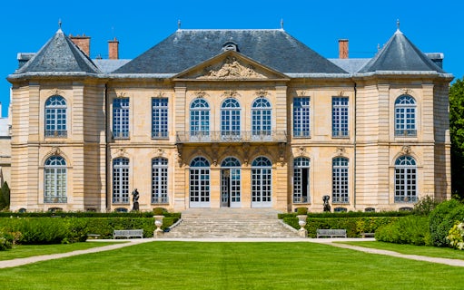 Rodin Museum facade with sculptures in Paris garden.
