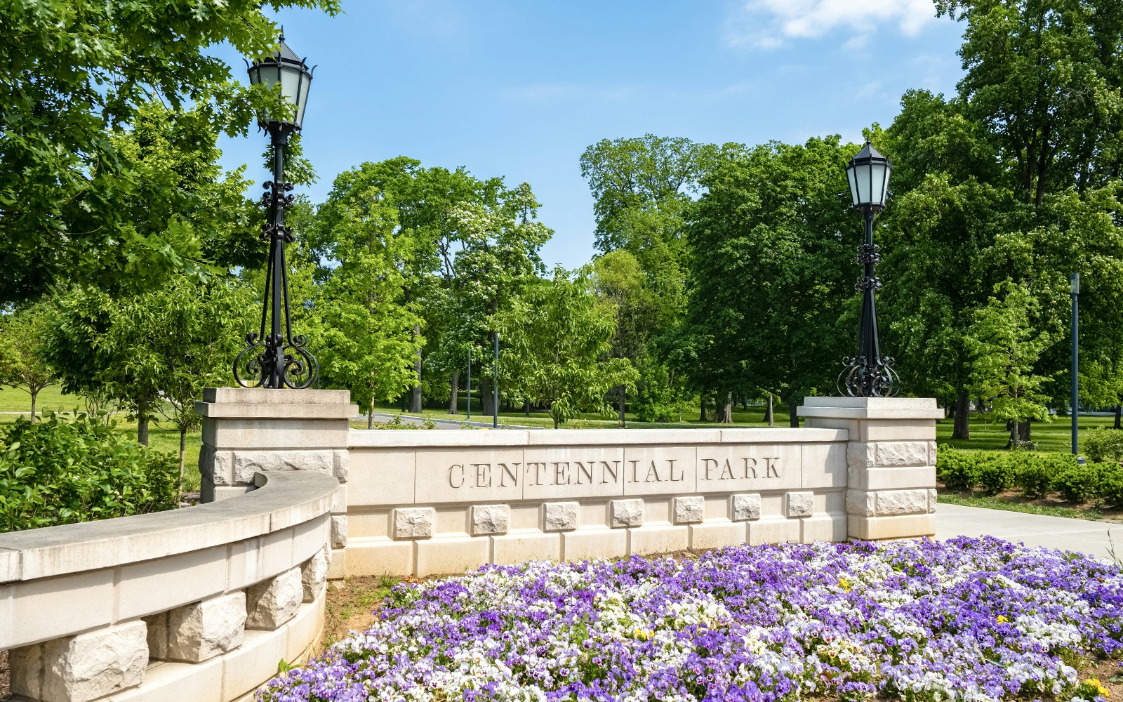 Centennial Park entrance with blooming purple flowers in Nashville.