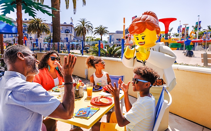 Family dining with LEGO character at LEGOLAND California.