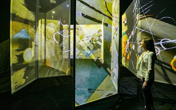 Immersive digital art display at Frameless London exhibition.