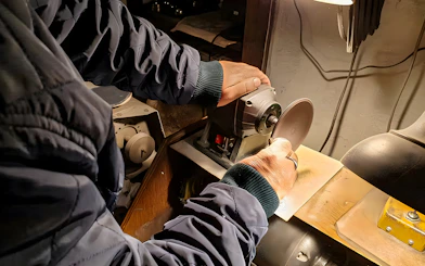 Craftsman polishing amber at Gdańsk workshop.