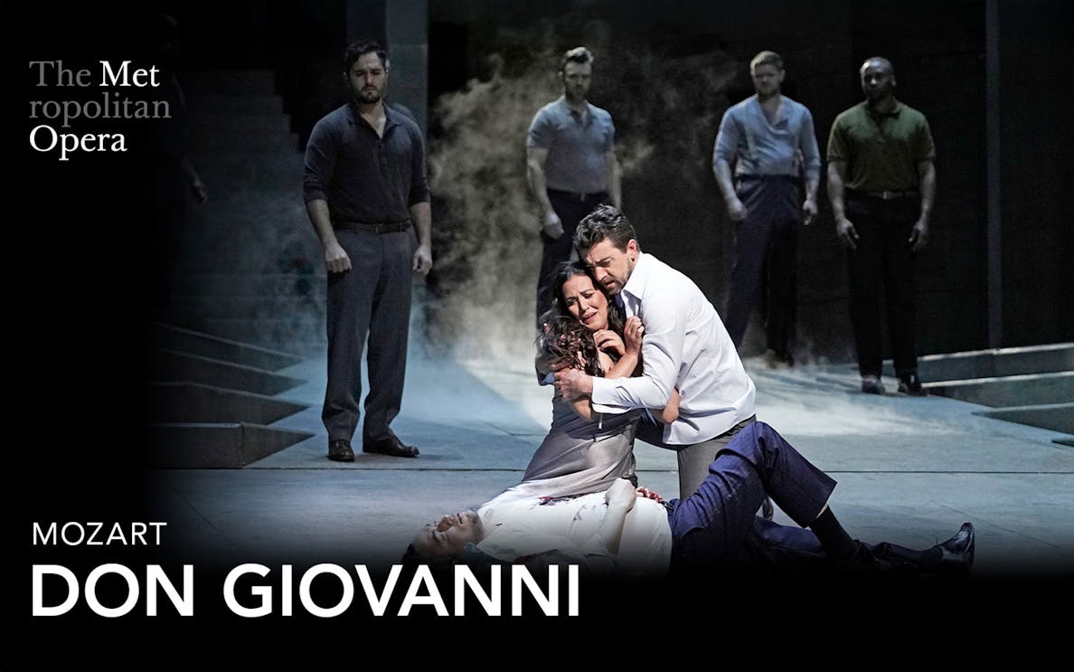Opera performers in a dramatic scene from Don Giovanni at the Metropolitan Opera.
