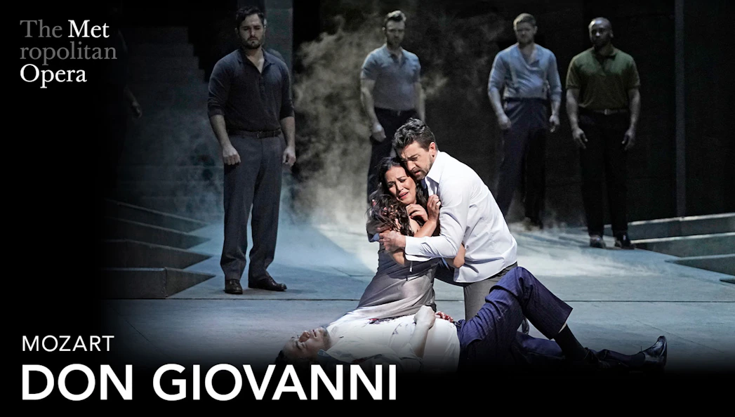 Opera performers in a dramatic scene from Don Giovanni at the Metropolitan Opera.