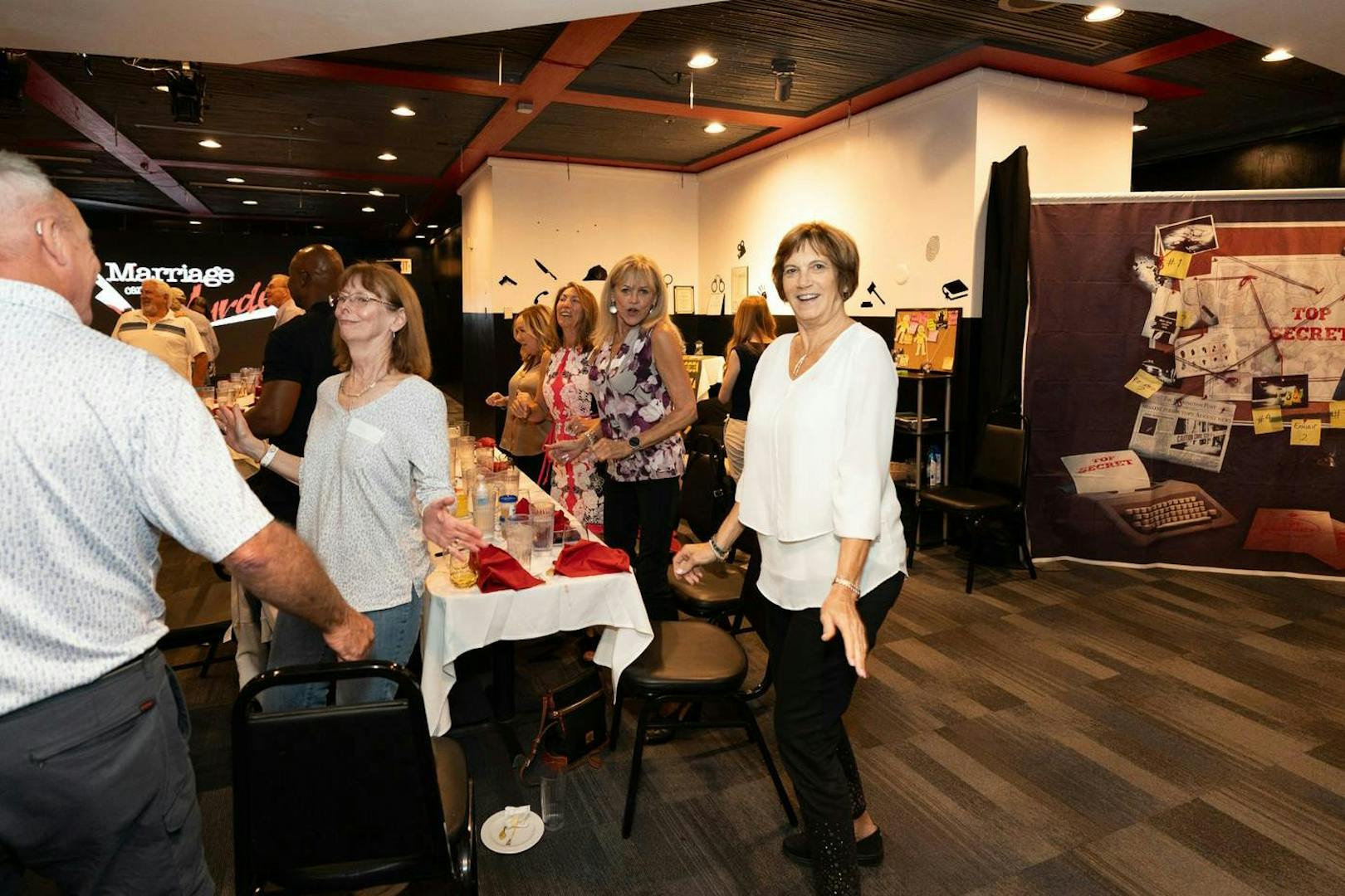 Guests interacting at Marriage Can Be Murder dinner show, Las Vegas.