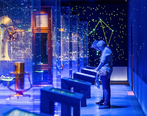 visitors observing navigational instruments at National Maritime Museum Tickets