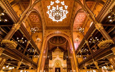 Great Synagogue interior with ornate chandeliers and detailed arches, Budapest.