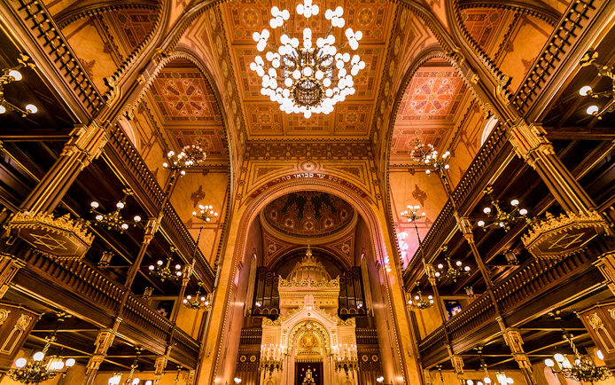 Great Synagogue interior with ornate chandeliers and detailed arches, Budapest.