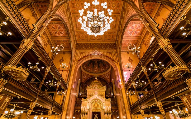 Great Synagogue interior with ornate chandeliers and detailed arches, Budapest.