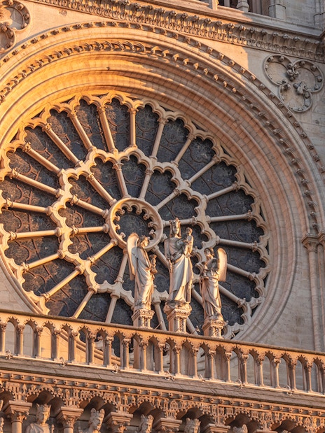 Notre Dame Cathedral facade with detailed rose window, Paris.