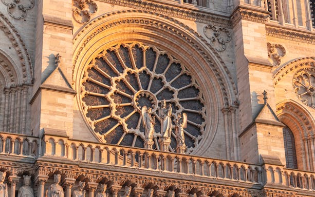 Notre Dame Cathedral facade with detailed rose window, Paris.