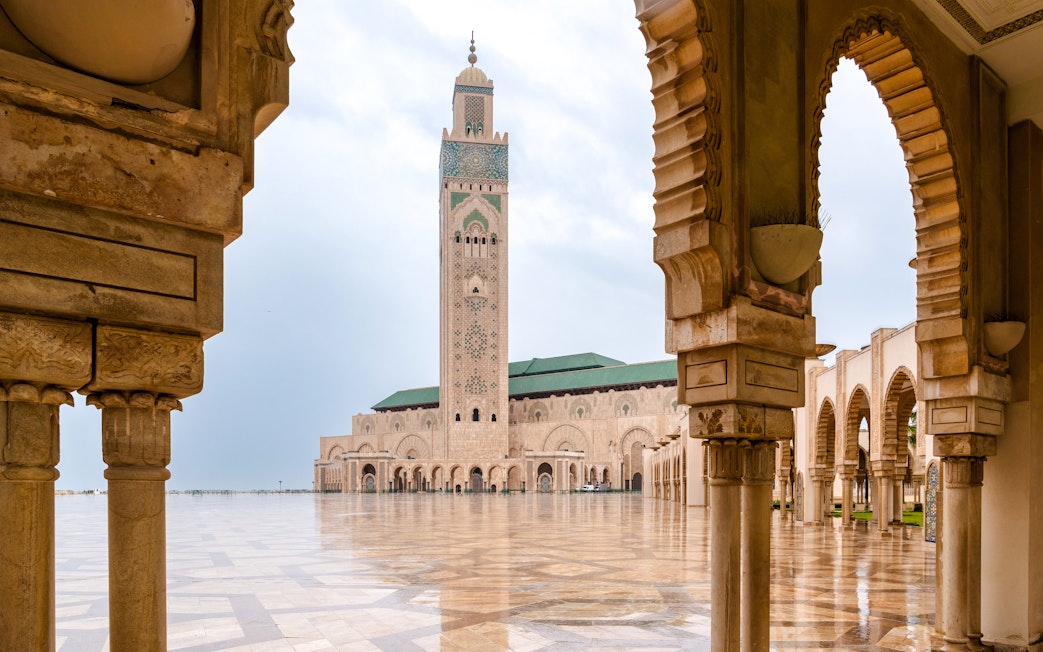Hassan II Mosque courtyard with arches and minaret, Casablanca.