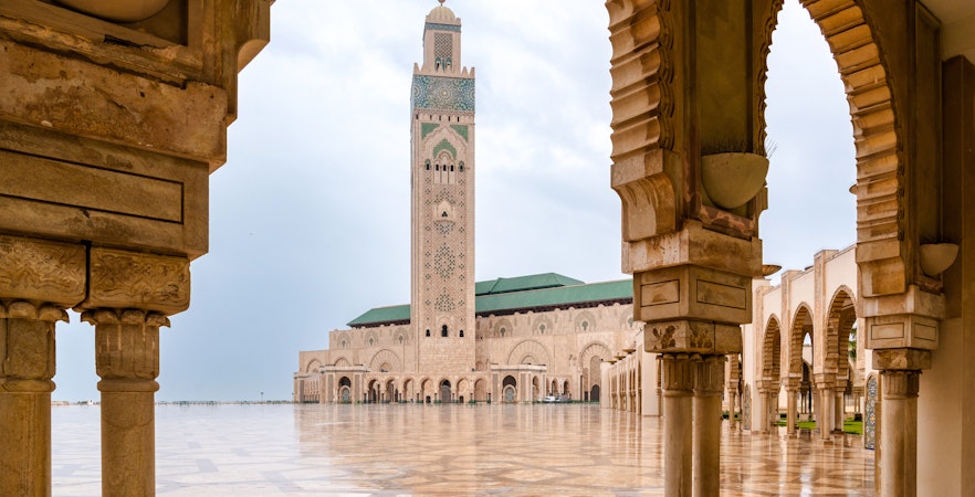 Hassan II Mosque courtyard with arches and minaret, Casablanca.