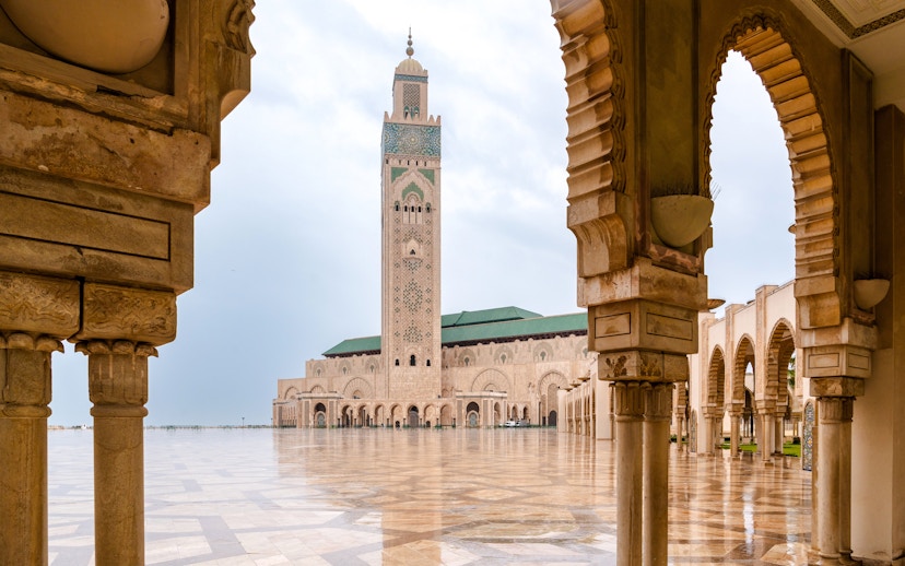 Hassan II Mosque courtyard with arches and minaret, Casablanca.
