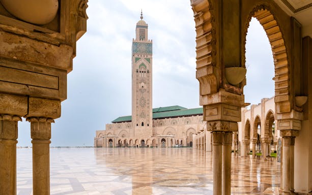 Hassan II Mosque courtyard with arches and minaret, Casablanca.