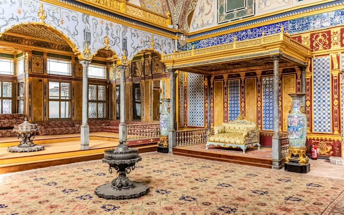 Topkapi Palace interior with ornate gold decorations and patterned tiles in Istanbul.