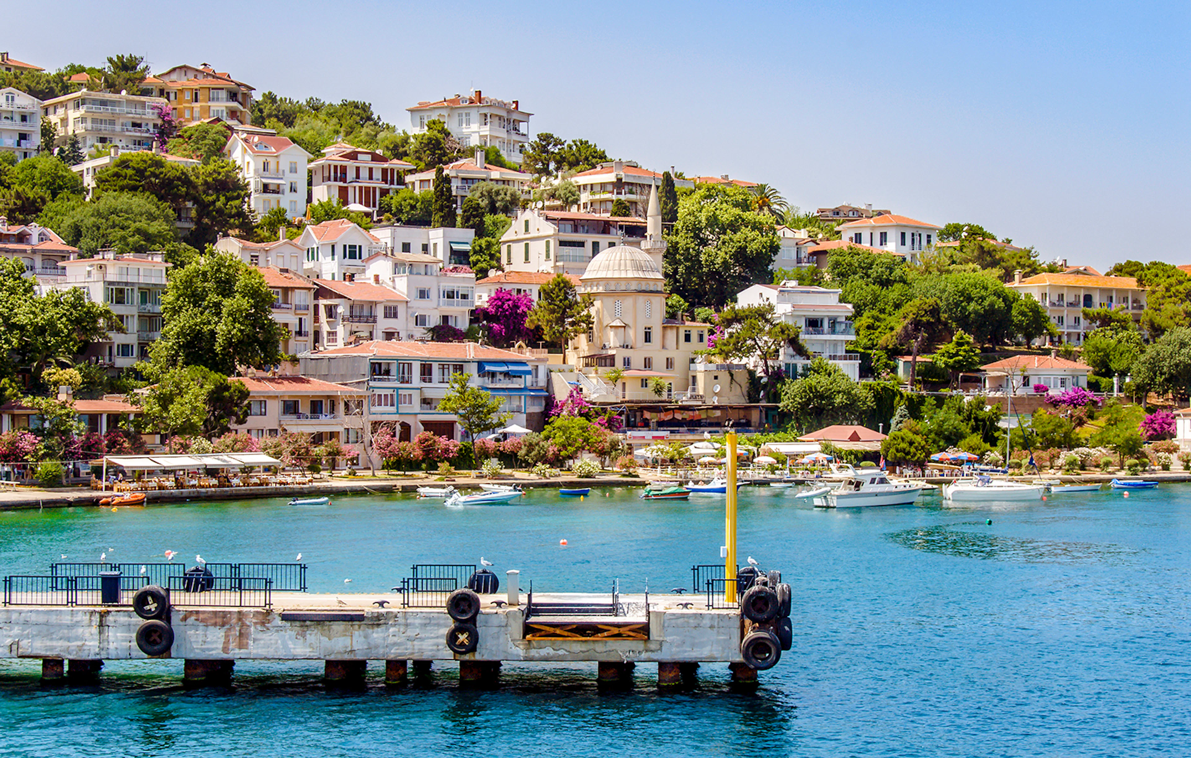 Burgaz Island waterfront with boats and hillside houses, Princes Islands, Istanbul.