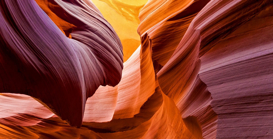 Aerial view of Antelope Canyon's swirling sandstone formations during a tour over Arizona.